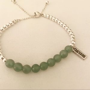 Green and silver colored adjustable bead bracelet